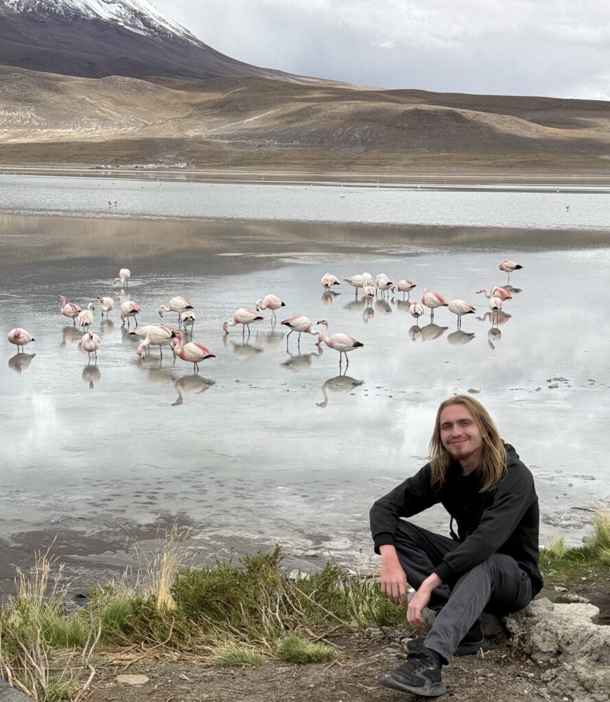 Spiro Stakauskas with flamingos in Bolivia