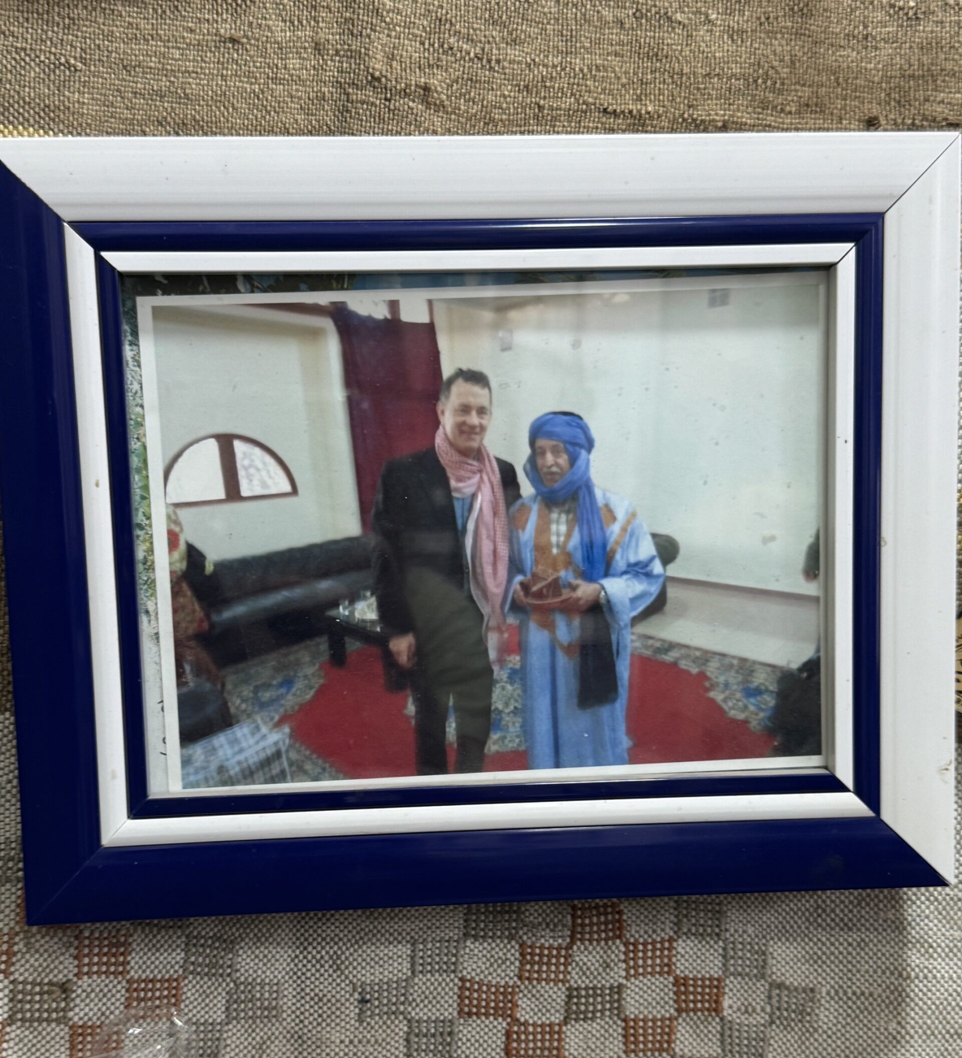 Photo taken by Spiro Stakauskas of the Fossil Museum owner Mr. Taki with Tom Hanks